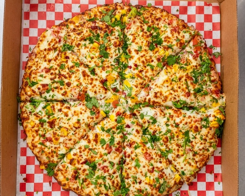 Creamy Corn Pizza topped with sweet corn and a creamy cheese sauce at City South Pizza Winnipeg